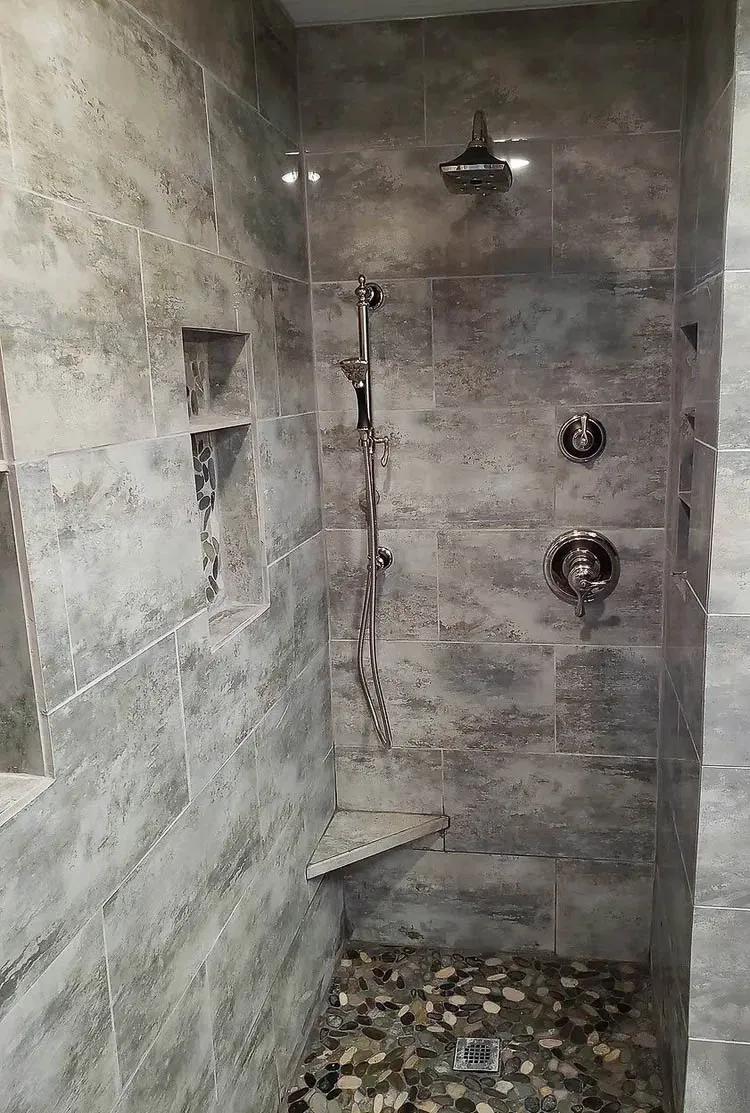 Granite Vanity & Walk-In Shower walk-in shower with custom foot prop and niches