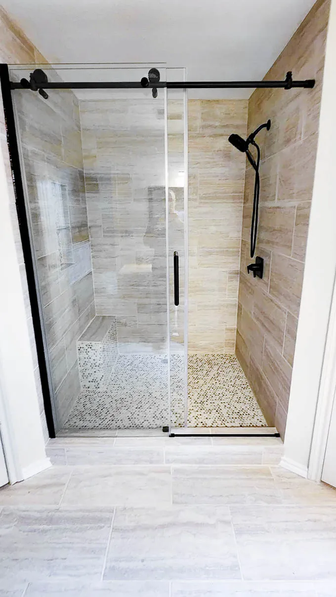 Commerce Bathroom frameless glass shower enclosure and tiling detail