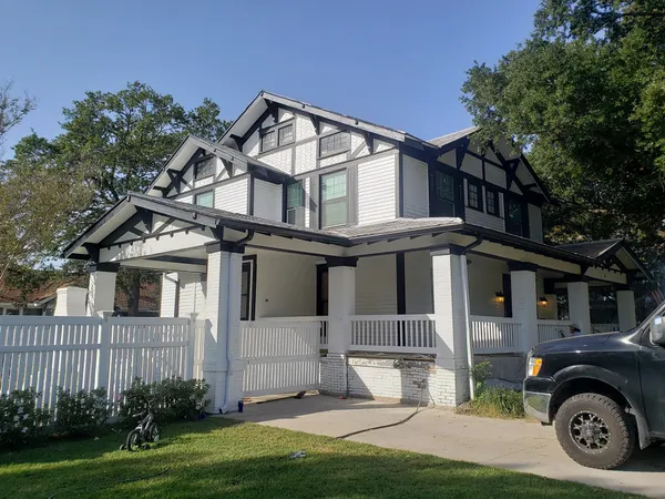 Exterior porch columns painted with weather-resistant white gloss