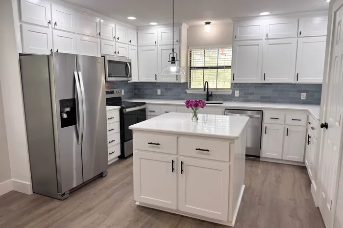Finished kitchen showing refaced and painted cabinets