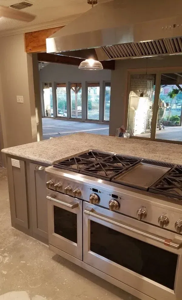 Kitchen sink area featuring single window layout and custom granite countertops