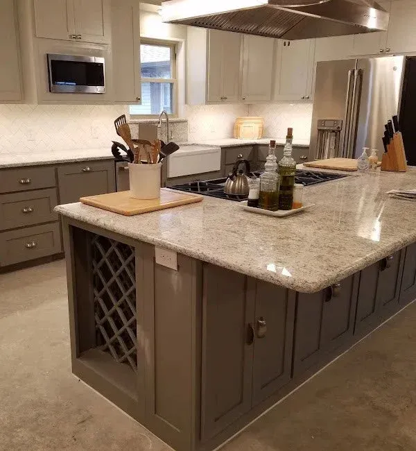Built-in wooden wine rack detail integrated into the kitchen island cabinet
