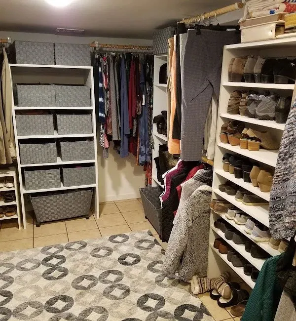 Finished raw wood built-in bookcases surrounding closet doorway