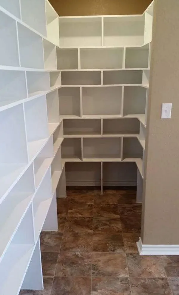 Close-up detail of the adjustable wood shelving and cabinet construction