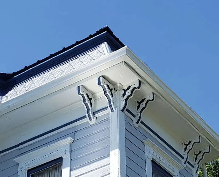 Trim detail showing clean contrasting white paint lines around windows and eaves