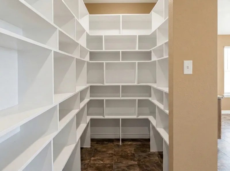 Custom built-in living room display shelving surrounding fireplace
